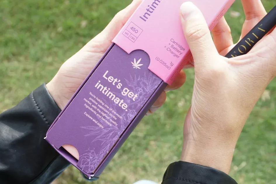 a person holding a purple card
